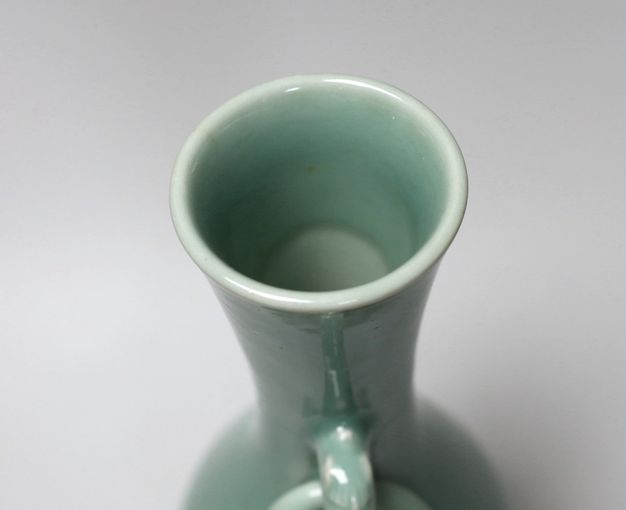 A Chinese celadon glazed two handled vase. 28cm high